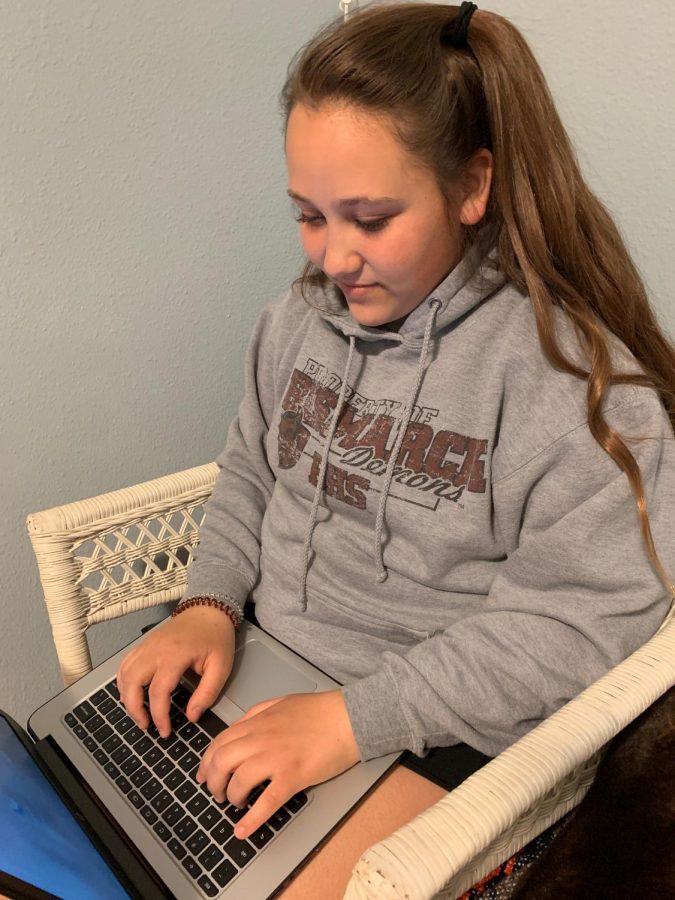 Online Assignment. Incoming BHS freshman Sydney Hall is working on an online assignment. Students were given work to complete at a distance from each other because of the school closings. “I am least looking forward to the homework [of online school],” Hall said. 