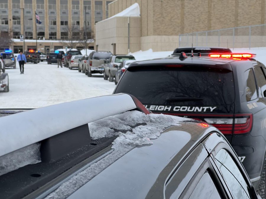 Blocked in. Teams of police guard Bismarck High School’s grounds during the swatting event on March 2, 2023. These actions were put into place to ensure proper safety precautions. “There were officers all over the place,” BHS school resource officer Brett Anderson said. “Blocking down streets to make sure people were not coming into the building.”